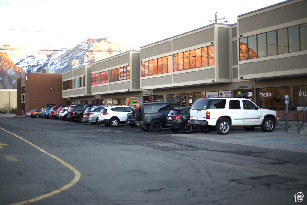 View of parking / parking lot with a mountain view