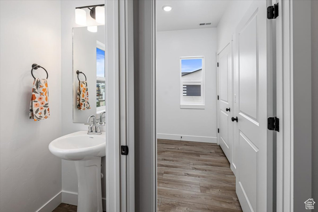 Bathroom featuring sink and hardwood / wood-style flooring