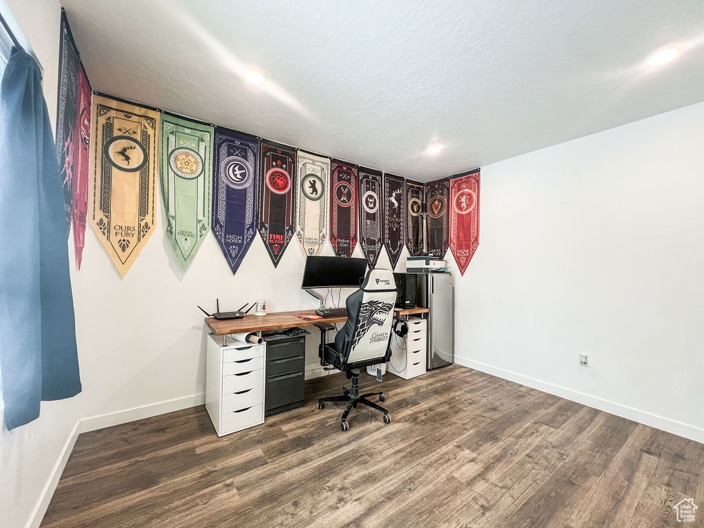 Office with dark wood-type flooring