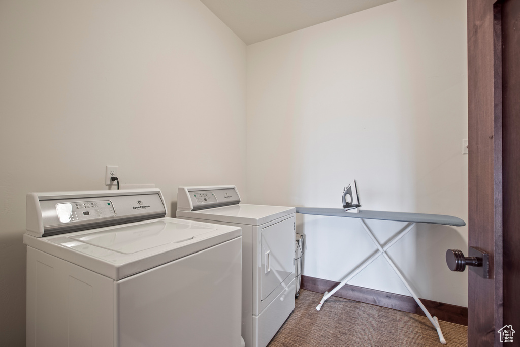 Laundry area with carpet and separate washer and dryer