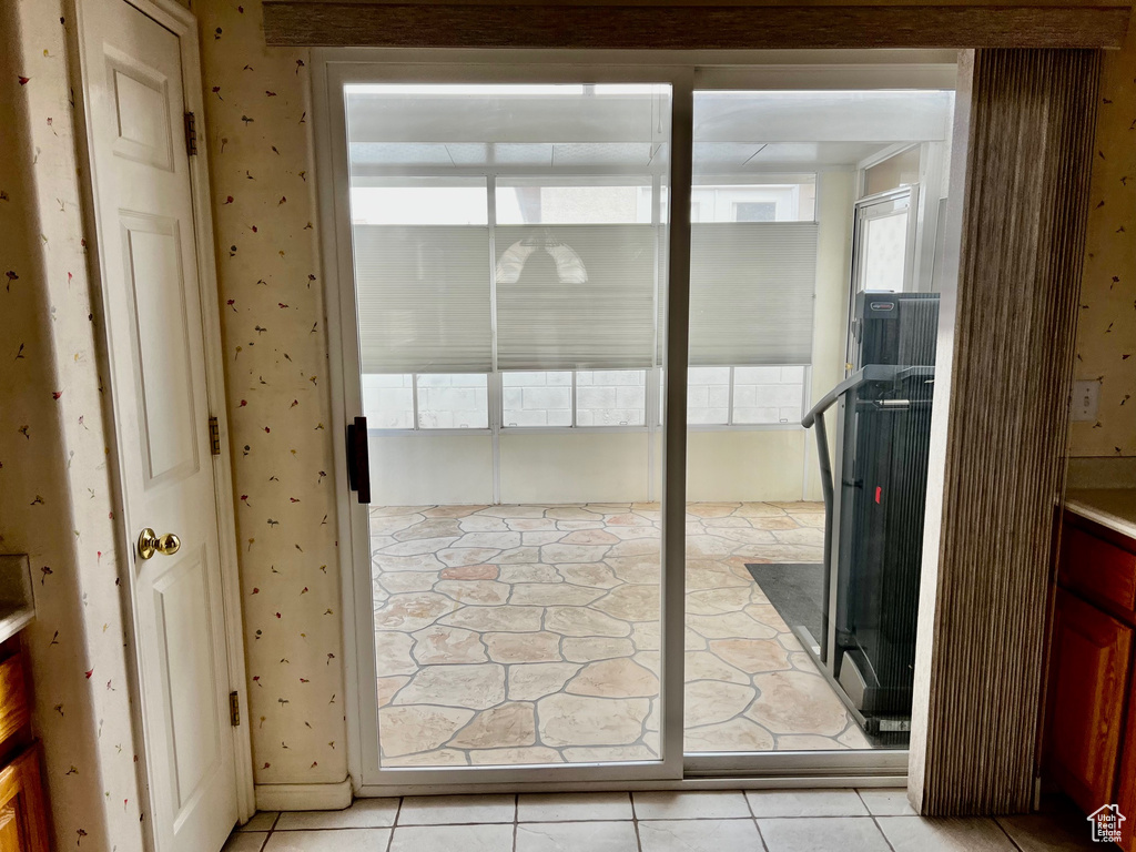 Entryway with light tile floors