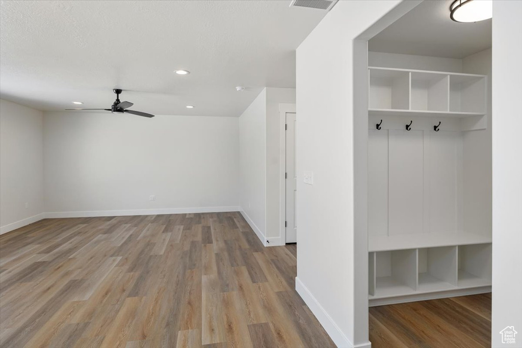 Mudroom with light hardwood / wood-style floors and ceiling fan