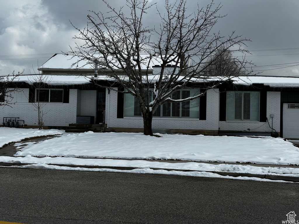 View of front of property with a garage