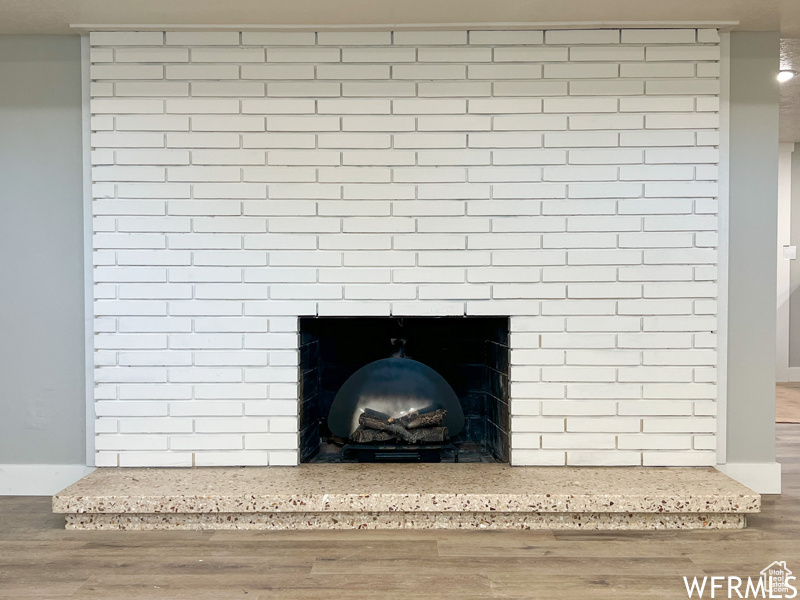 Interior details featuring a fireplace and hardwood / wood-style floors