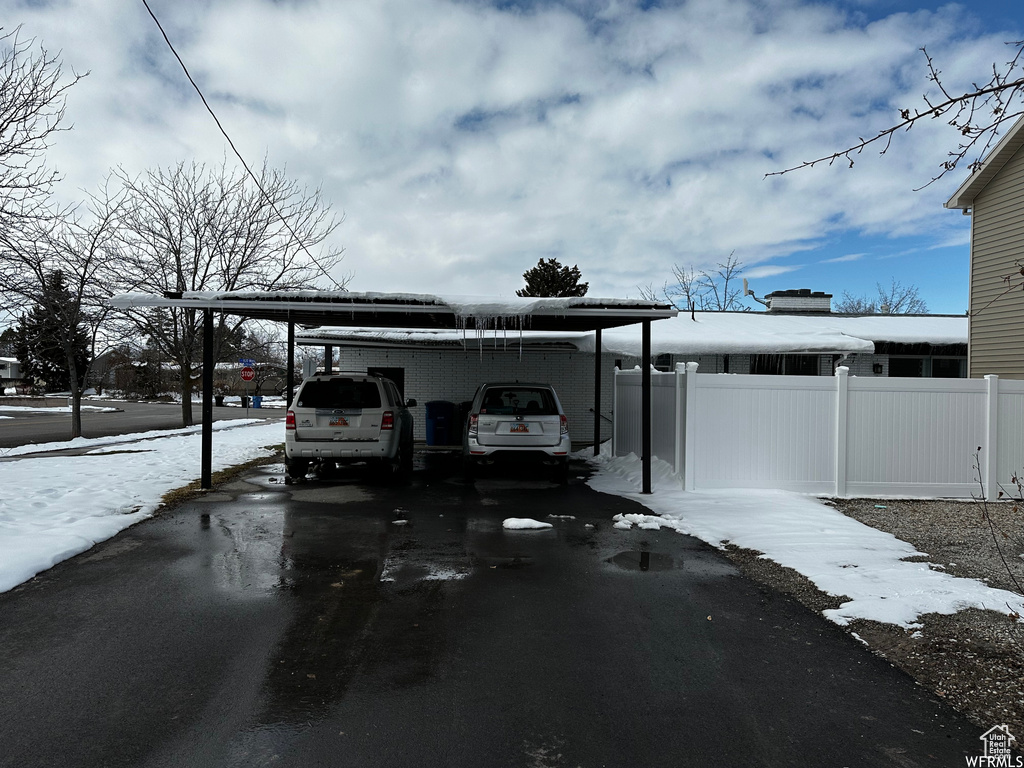 Exterior space featuring a carport