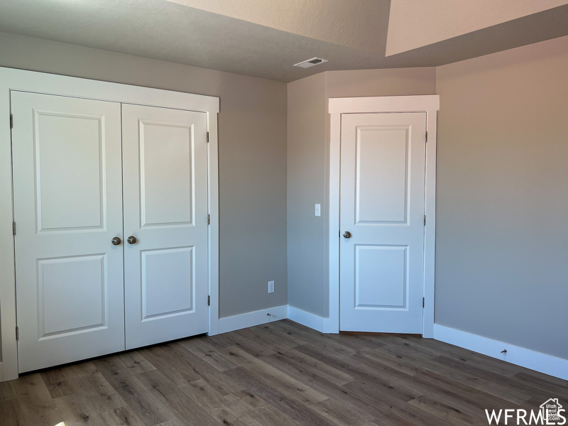 Interior space featuring dark hardwood / wood-style flooring