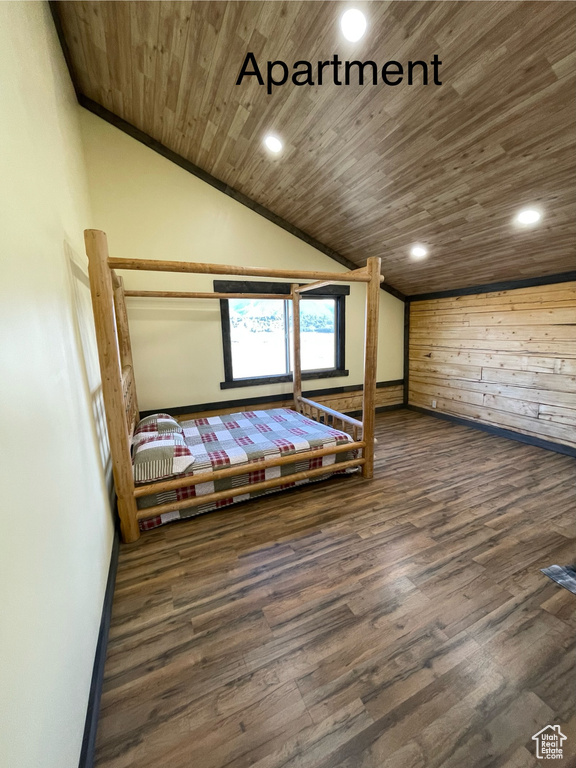 Unfurnished bedroom featuring wood ceiling, high vaulted ceiling, and dark hardwood / wood-style floors