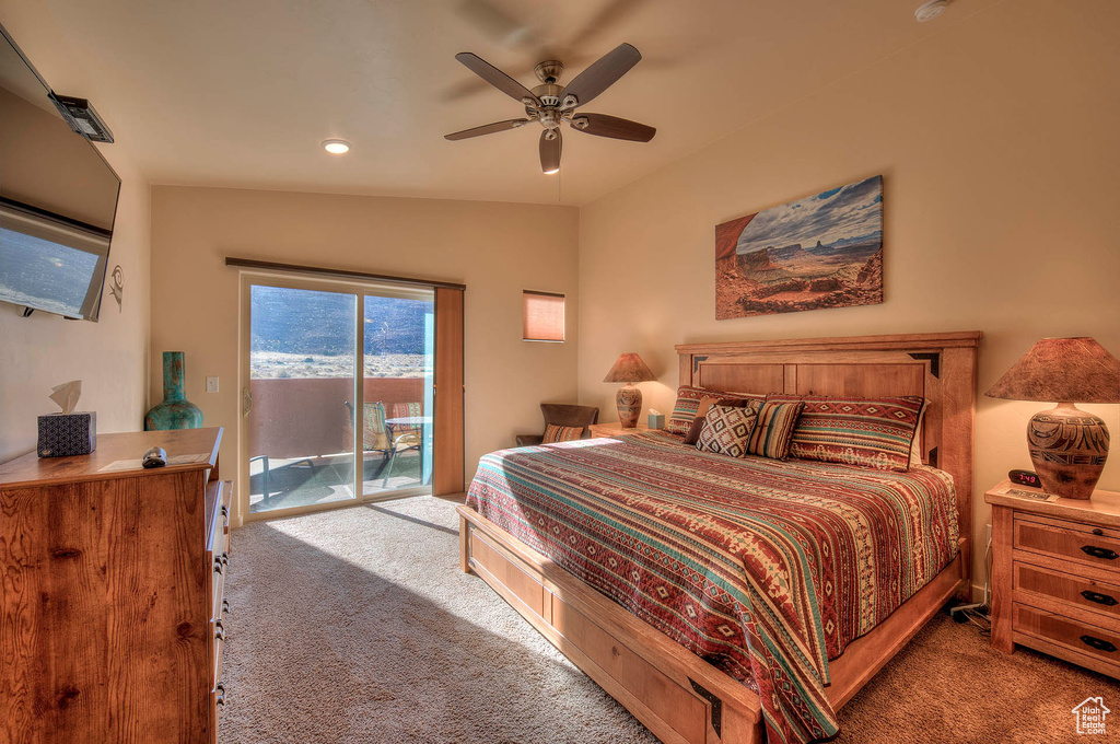 Carpeted bedroom featuring lofted ceiling, access to outside, and ceiling fan