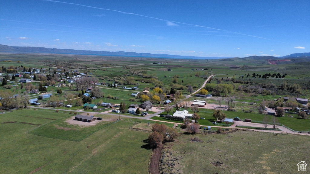 Birds eye view of property with a mountain view and a rural view