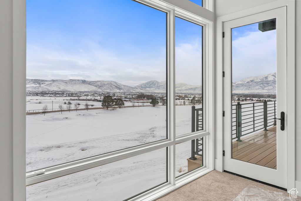 Doorway to outside with a mountain view