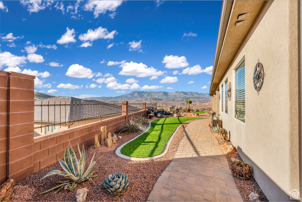 View of yard featuring a patio and a mountain view