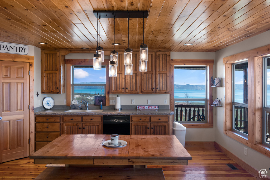 Kitchen with sink, a water and mountain view, wood ceiling, black dishwasher, and hardwood / wood-style flooring