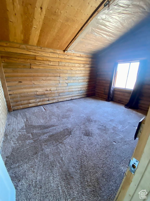 Bonus room with carpet and wood ceiling
