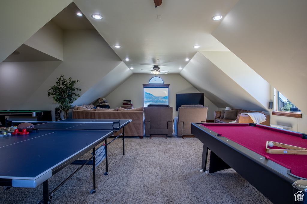 Playroom featuring light carpet, billiards, lofted ceiling, and ceiling fan