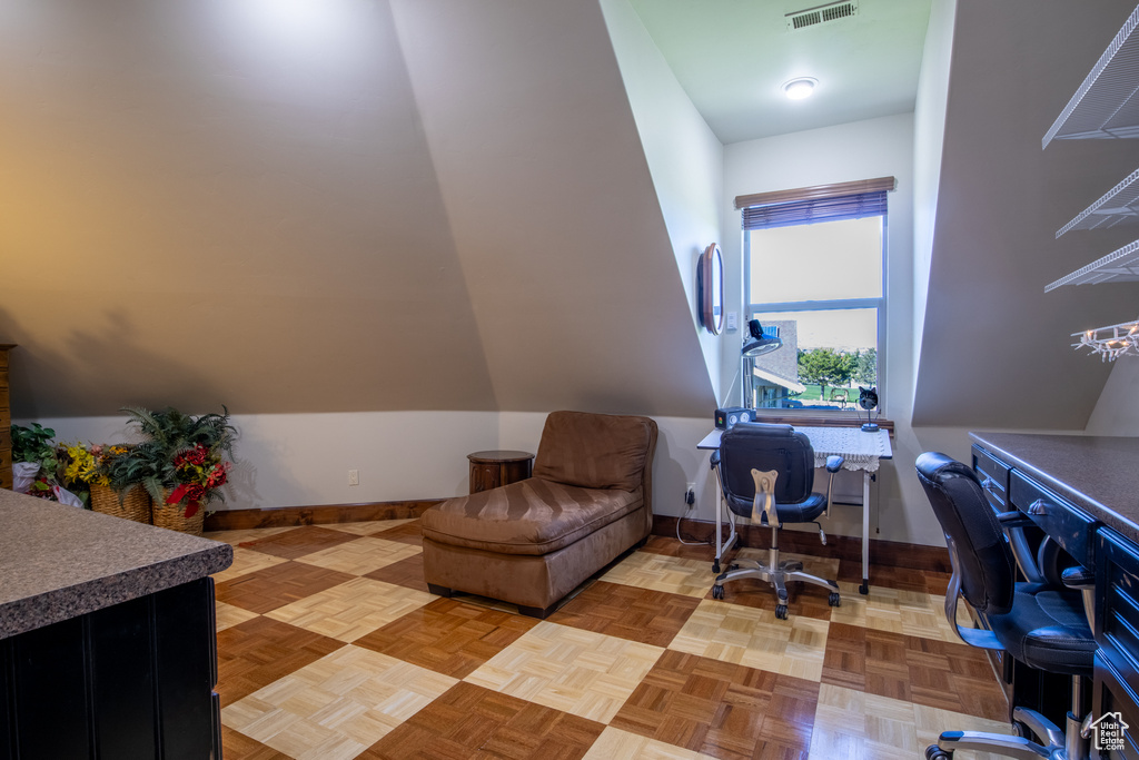 Home office with light parquet floors