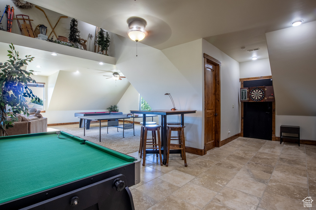 Rec room with light tile floors, pool table, and ceiling fan