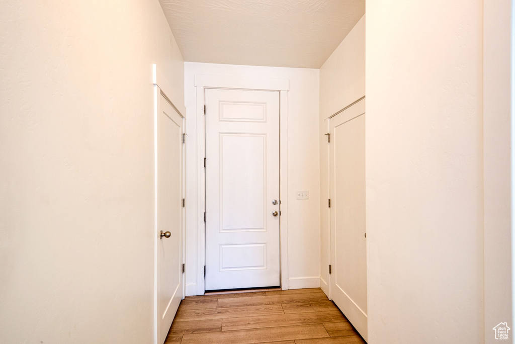 Corridor featuring light hardwood / wood-style floors