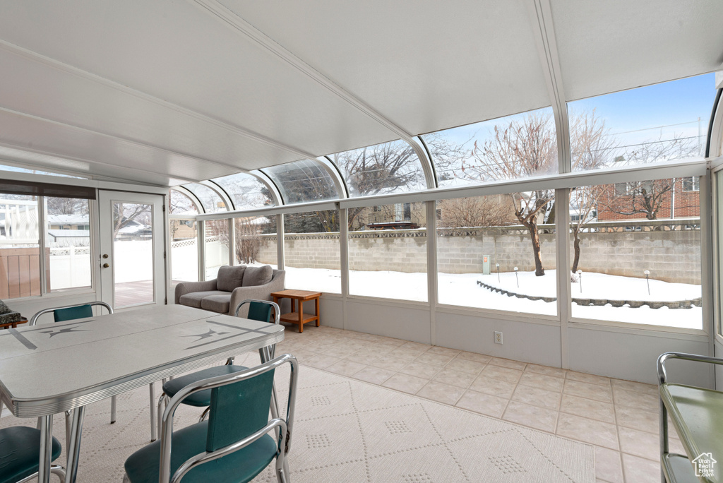 Sunroom featuring a healthy amount of sunlight