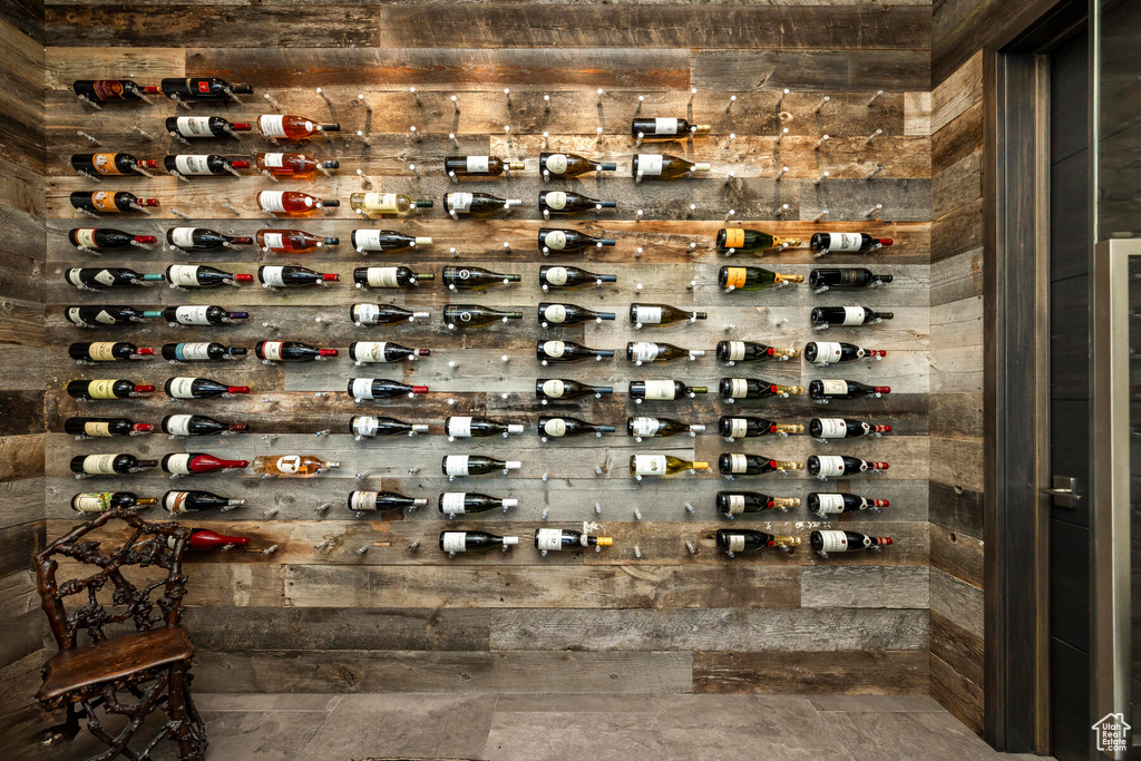 Wine cellar featuring dark tile floors