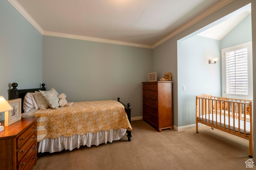 Bedroom featuring ornamental molding and light colored carpet