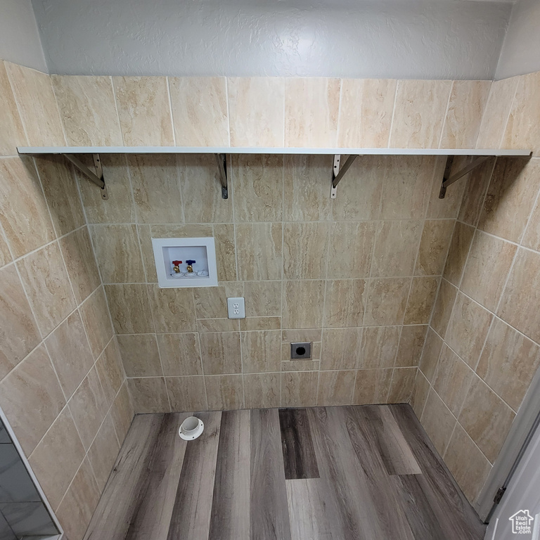 Bathroom with hardwood / wood-style flooring