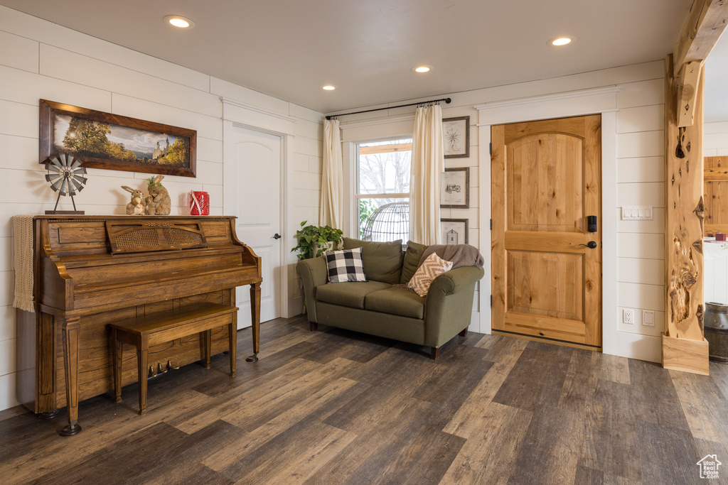 Sitting room with dark hardwood / wood-style flooring