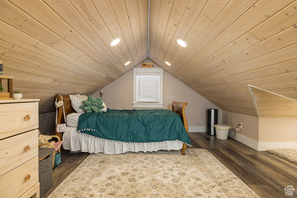 Bedroom with dark wood-type flooring, wooden ceiling, and vaulted ceiling