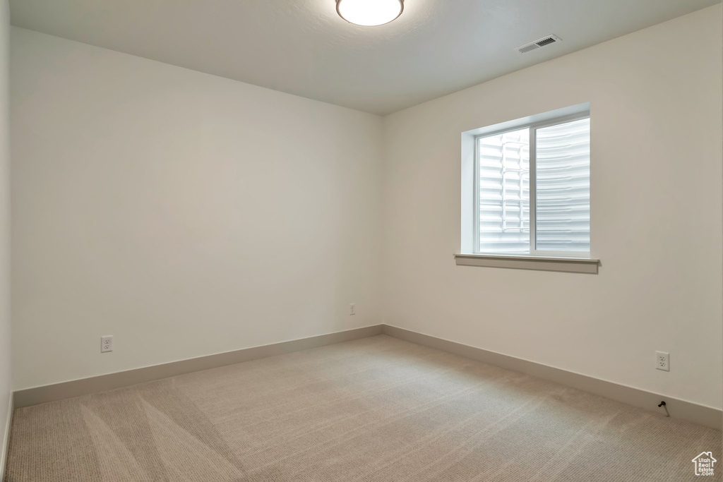 View of carpeted spare room