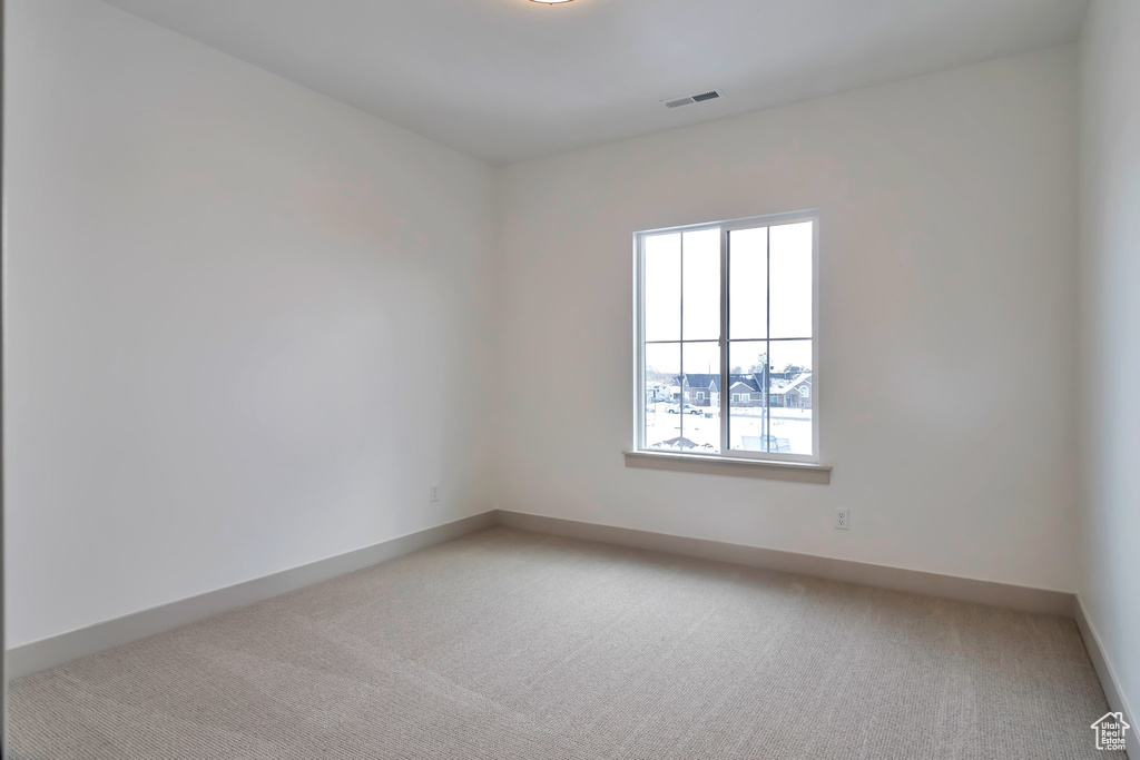 Spare room with light carpet