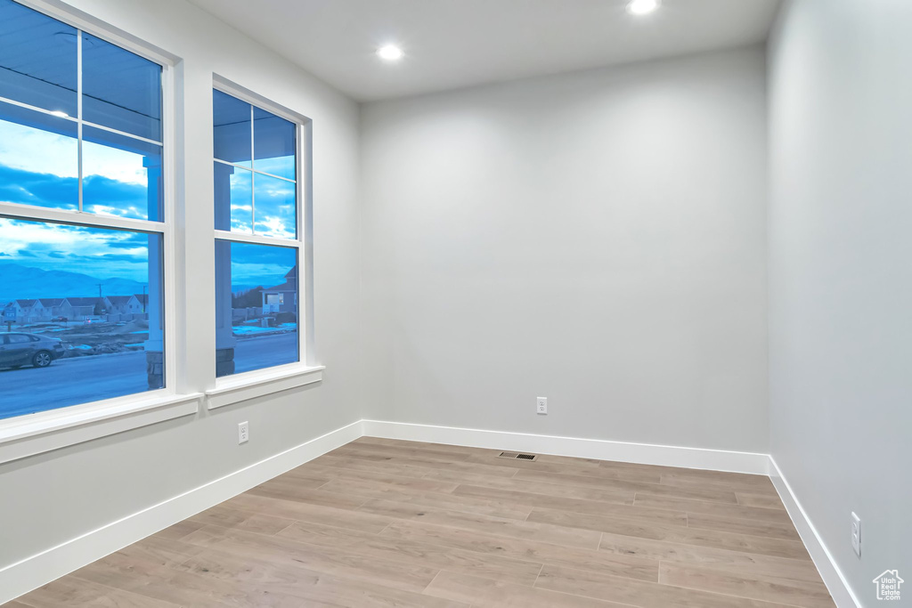 Spare room featuring light wood-type flooring