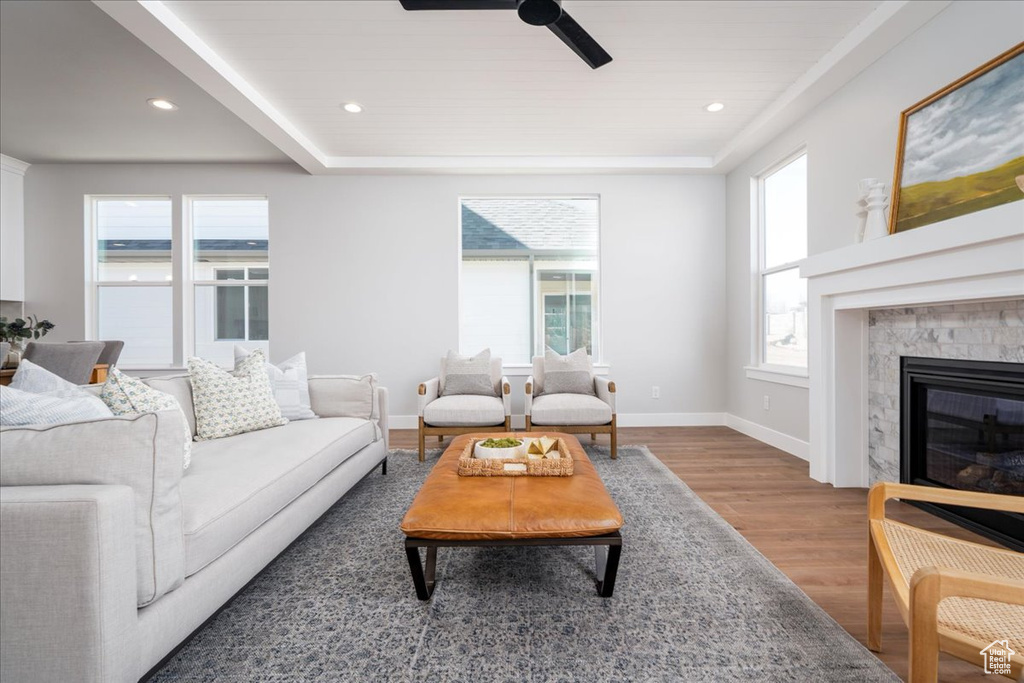 Living room featuring hardwood / wood-style flooring and ceiling fan