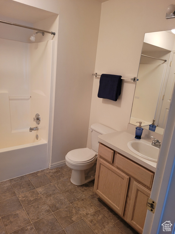 Full bathroom featuring tile floors, vanity, shower / bathing tub combination, and toilet