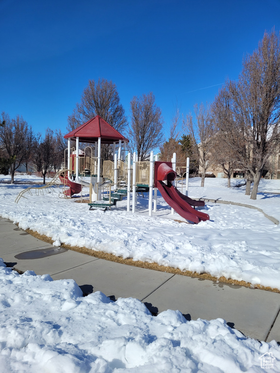 Snow covered playground with a gazebo