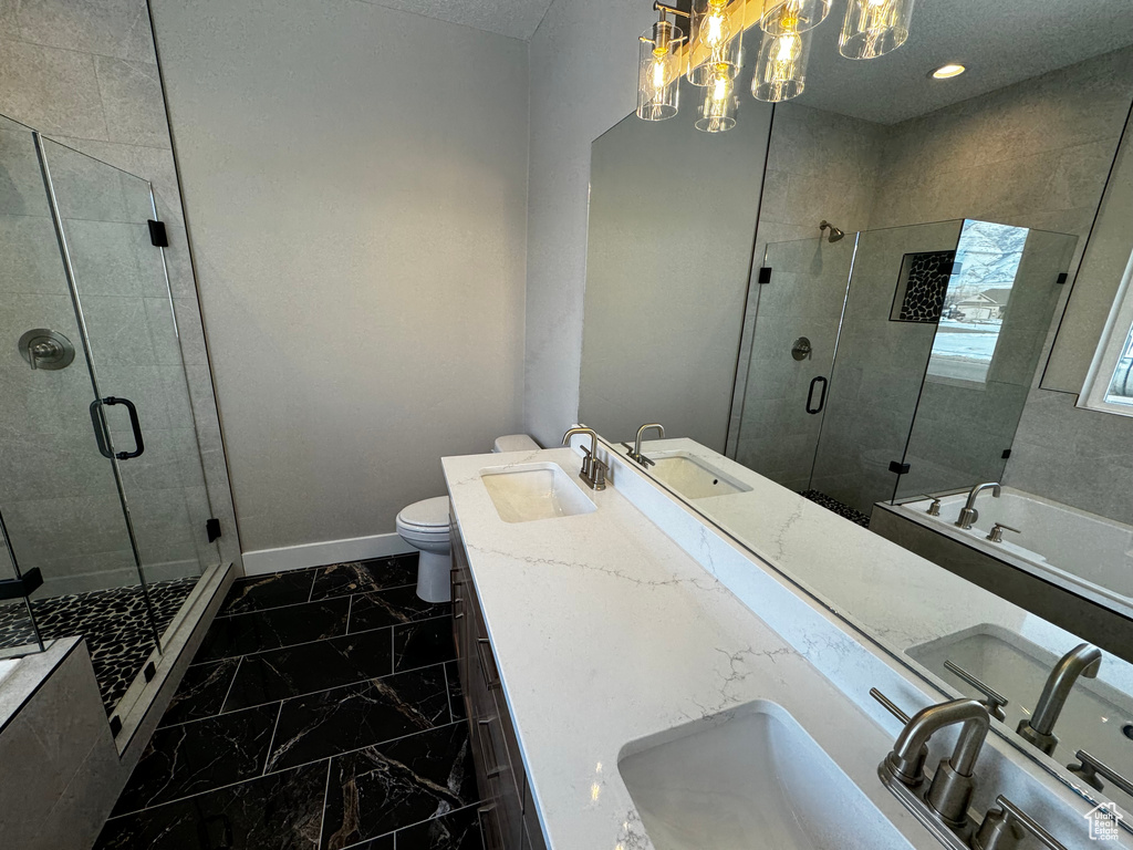 Full bathroom featuring oversized vanity, dual sinks, toilet, independent shower and bath, and tile flooring