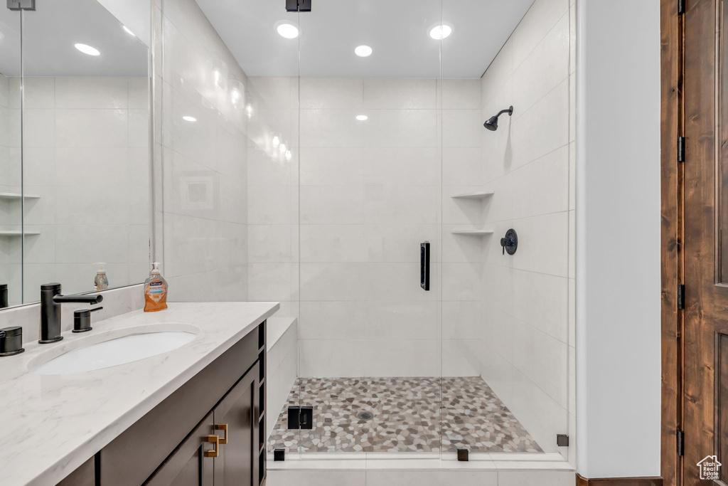 Bathroom featuring vanity and walk in shower