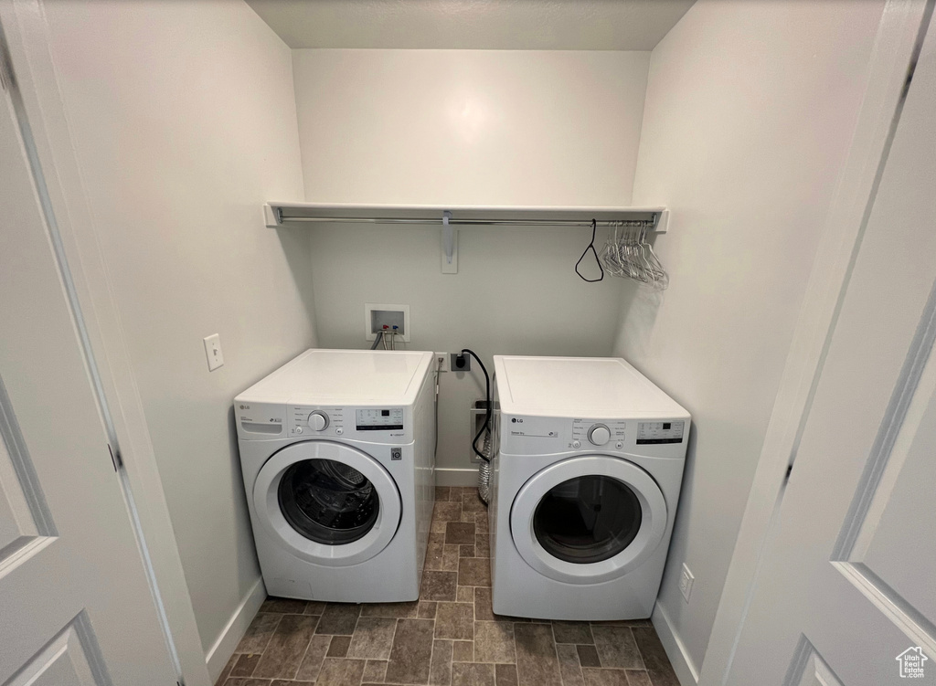 Washroom featuring washing machine and clothes dryer, hookup for a washing machine, and electric dryer hookup