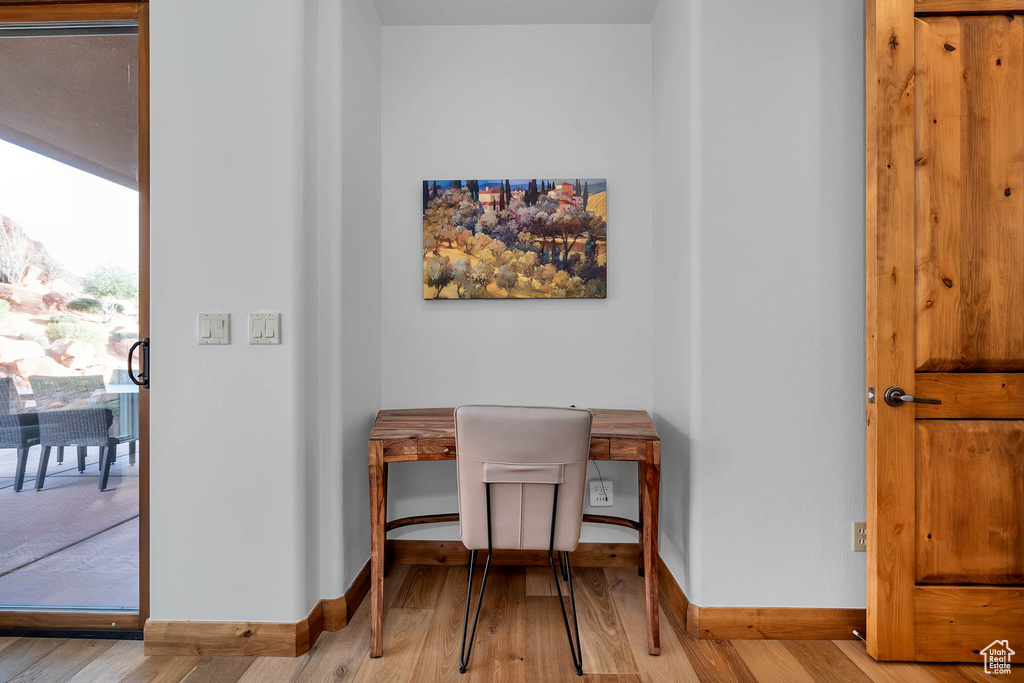 Dining area with light hardwood / wood-style flooring
