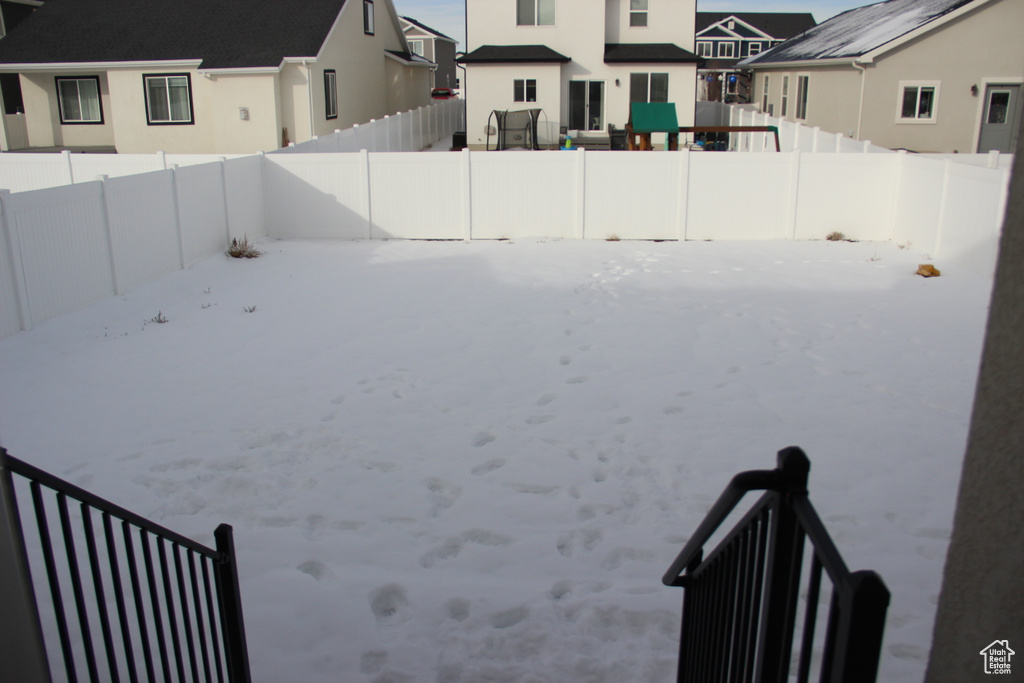 View of yard layered in snow