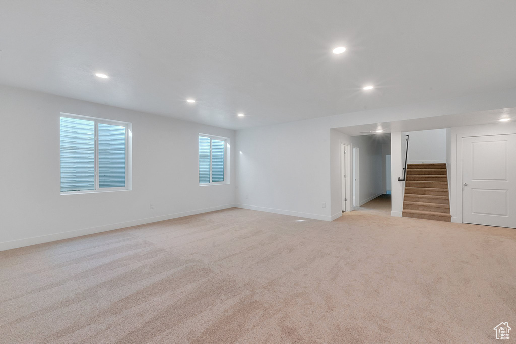 Unfurnished room with light carpet