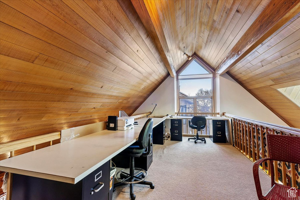 Office featuring vaulted ceiling with beams, light carpet, and wood ceiling