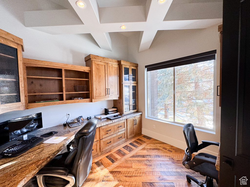 Office featuring coffered ceiling and built in desk