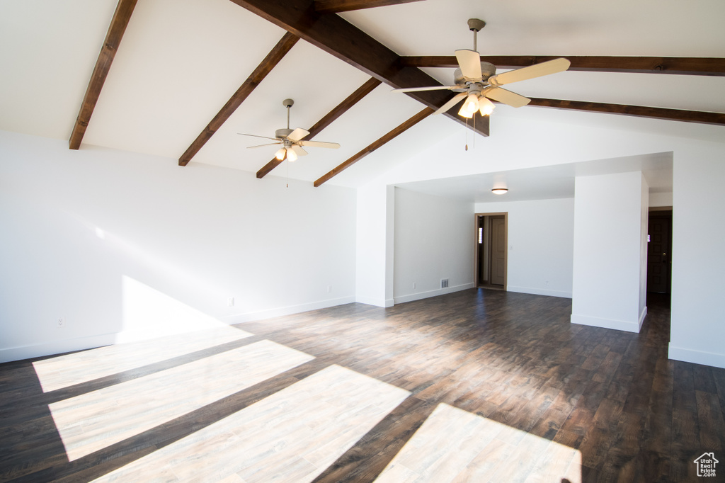 Unfurnished room with high vaulted ceiling, ceiling fan, beam ceiling, and dark wood-type flooring