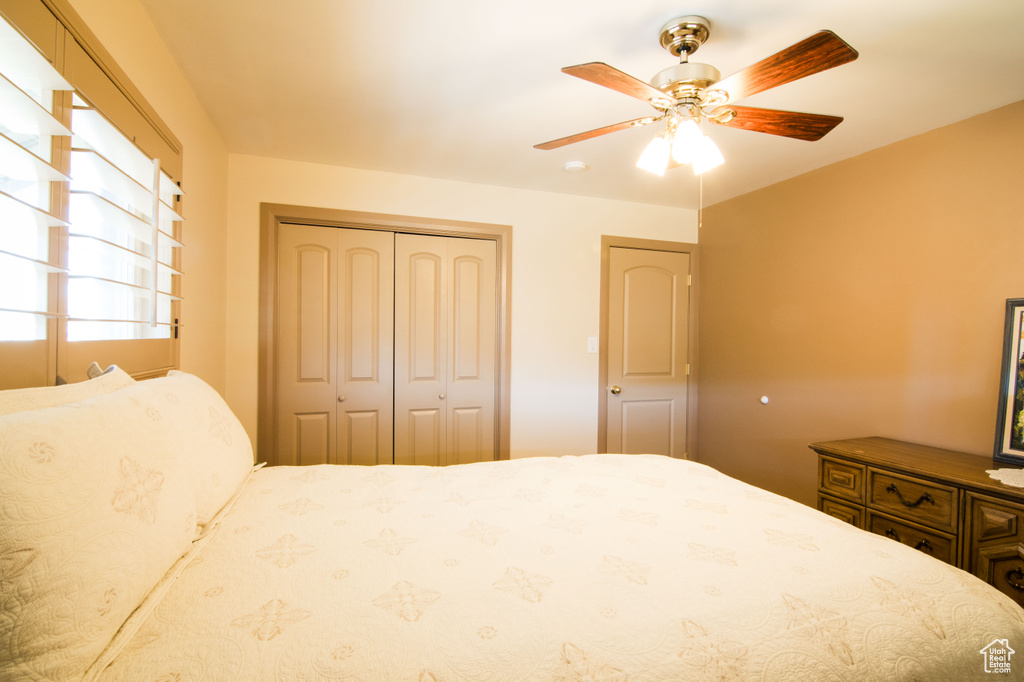 Bedroom with a closet and ceiling fan
