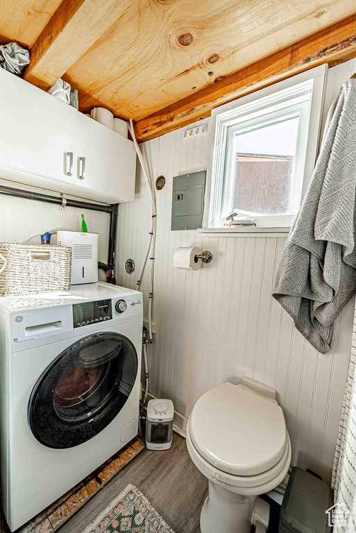 Washroom featuring washer / dryer and dark hardwood / wood-style flooring