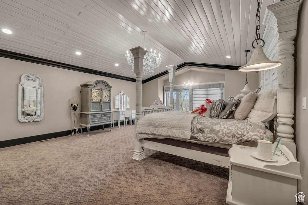 Carpeted bedroom with an inviting chandelier, lofted ceiling, and ornamental molding