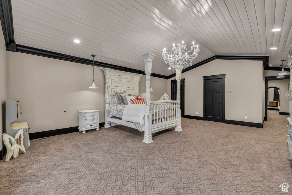 Bedroom featuring crown molding, a chandelier, and light colored carpet