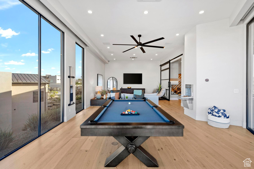 Game room featuring billiards, ceiling fan, and light wood-type flooring