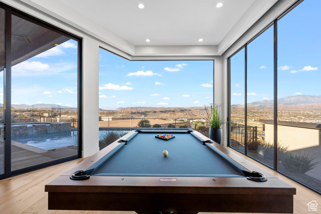 Recreation room featuring a mountain view, billiards, and light wood-type flooring