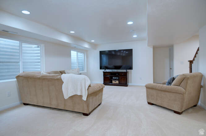 Living room featuring light colored carpet