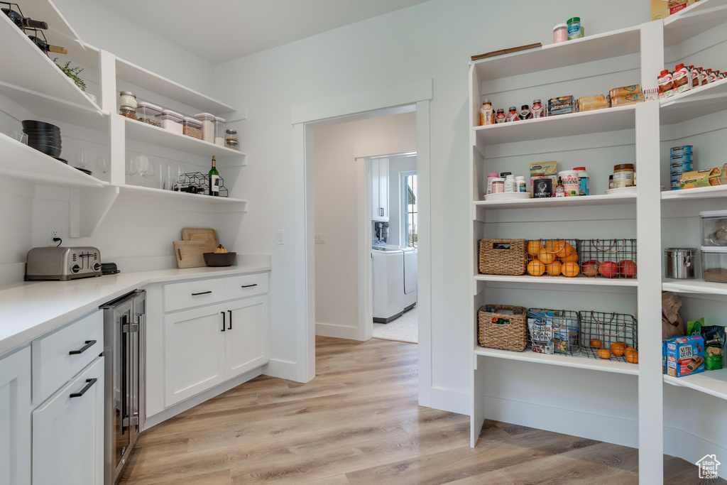 Pantry featuring beverage cooler